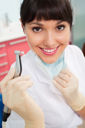 portrait of beautiful doctor with dental's instrumentの写真素材