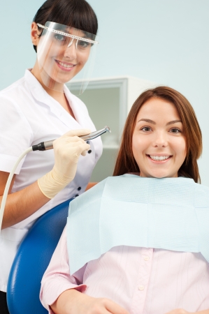 portrait of doctor and patient at dentist's officeの写真素材