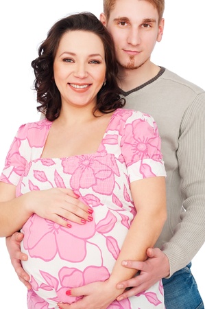 portrait of smiling young pregnant woman with her husband beside her の写真素材