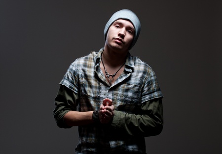 portrait of stylish man over dark background の写真素材