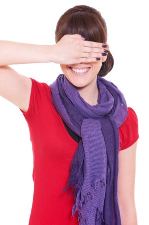 portrait of young smiley woman with closed eyes by hand の写真素材