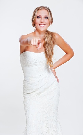 laughing bride pointing at youの写真素材