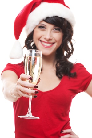 happy santa girl with glass over white background. focus on glass の写真素材