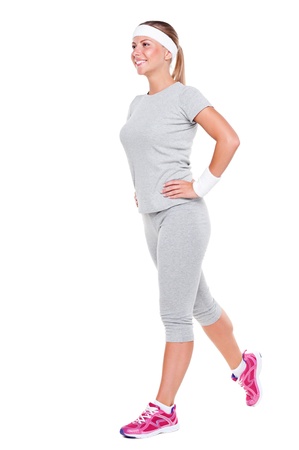 fitness woman doing exercises over white backgroundの写真素材