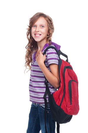 smiley girl of about ten holding red rucksack. isolated on white backgroundの写真素材