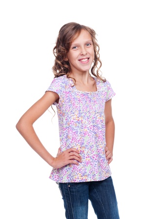happy little girl in jeans smiling. isolated on white backgroundの写真素材