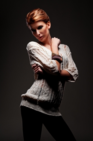 glamor young model posing over black backgroundの写真素材