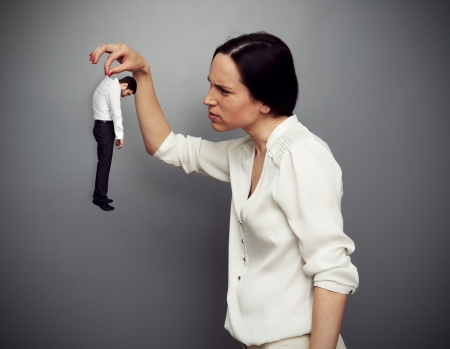 concept photo of woman boss disapprovingly considering her subordinateの写真素材