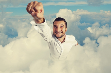 smiley and happy man flying in the skyの写真素材