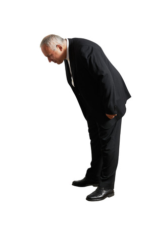 senior man looking down. isolated on white backgroundの写真素材