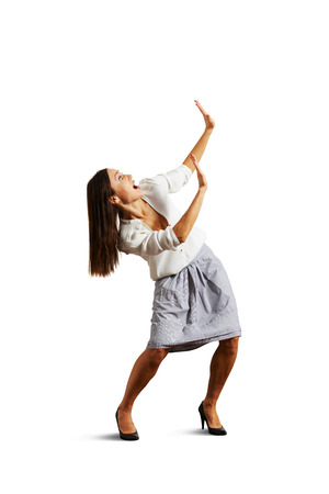 shocked woman looking up and screaming. isolated on white backgroundの写真素材