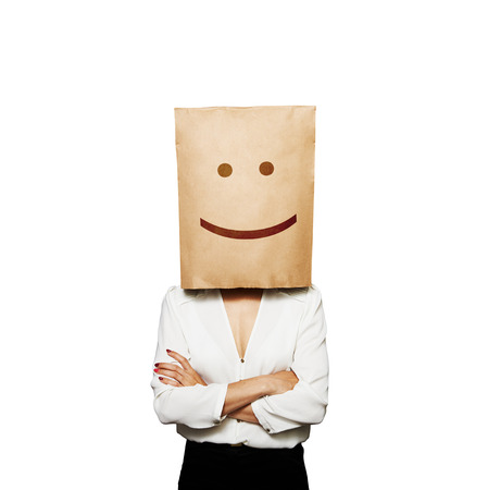 funny picture of businesswoman with paper bag on her headの写真素材
