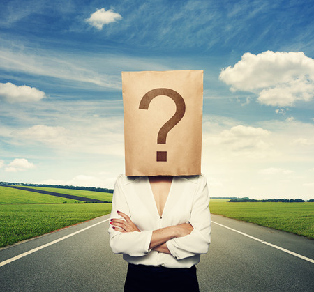 businesswoman with big question on the paper bagの写真素材