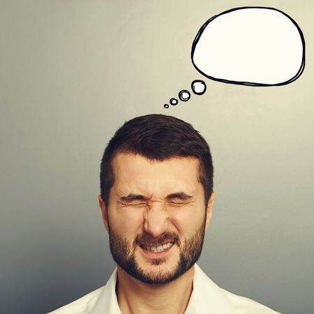 emotional man with drawing speech bubble over grey backgroundの写真素材