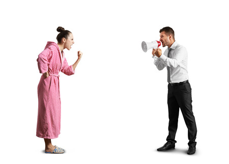 quarrel between angry man and screaming woman. isolated on white backgroundの写真素材