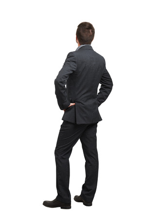 back view of man in formal wear looking up. isolated on white backgroundの写真素材