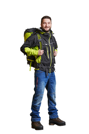 full-length portrait of smiley traveller with backpacker. isolated on white backgroundの写真素材