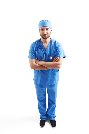view from above of serious man in blue scrubs over white backgroundの写真素材