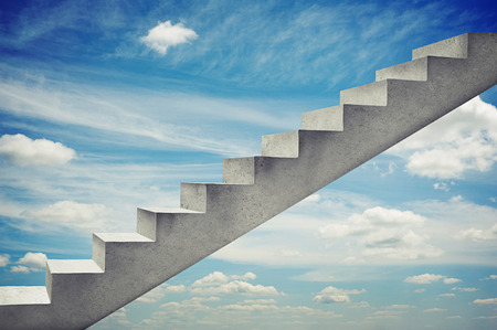 concrete grey stairs over blue sky