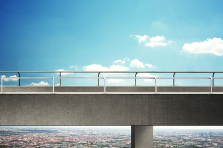 high concrete bridge above cityscapeの写真素材