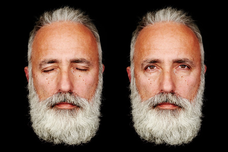 two faces of senior bearded man over black background