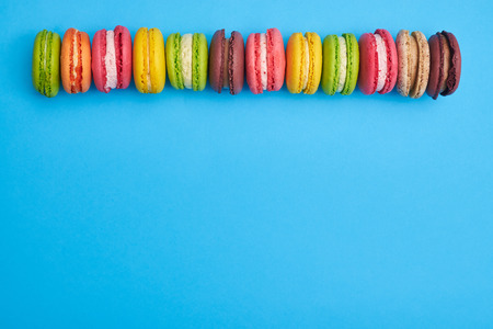 Top view of a bundle of traditional macaroons with a copy space. Row of french colorful macaroons の写真素材