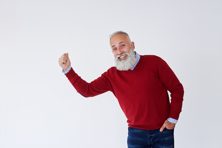 Closeup of candid bearded mature man raising hans and looking at cameraの写真素材