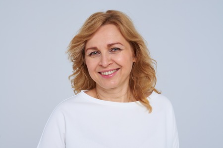 Close-up portrait of smiley mature woman