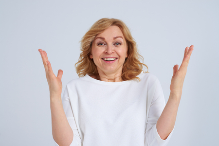 Surprised smiley blondの写真素材