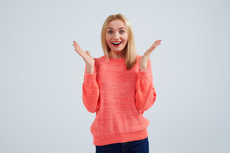 happy blond in sweaterの写真素材
