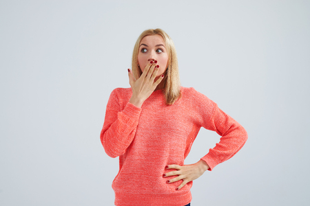 shocked blond in sweaterの写真素材