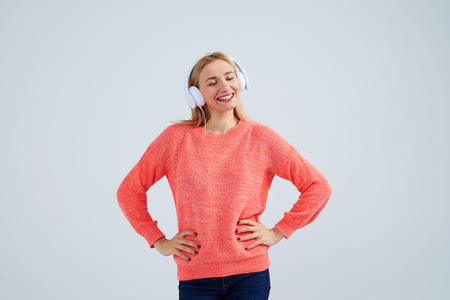 blond in headphones with closed eyesの写真素材