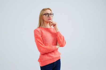 thoughtful blond in glassesの写真素材