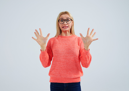 shocked blond in glassesの写真素材