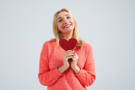 dreamy blond with red heartの写真素材