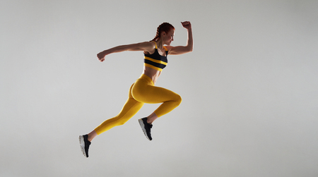 strong woman running fastの写真素材