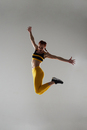 happy sportswoman jumpingの写真素材