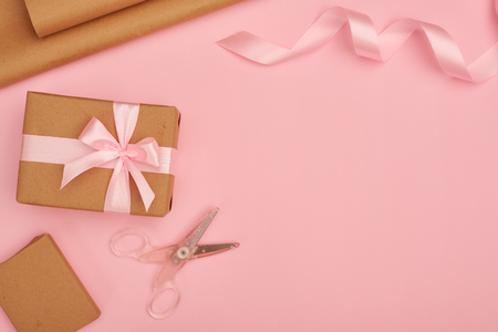 Gift wrapping set on pink flatlayの写真素材