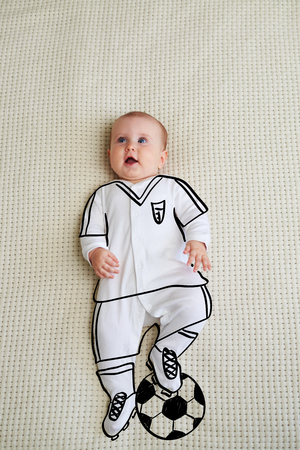 Cute baby girl sketched as footballerの写真素材