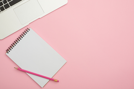 Workspace with jotter and laptopの写真素材