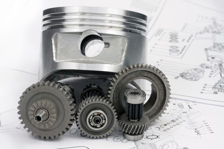 The reducer, key, the piston, head and other details lie on the drawing.の写真素材