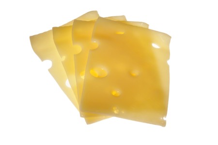 Slices of cheese, illuminated in the rear, on white backgroundの写真素材