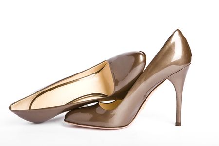 Beige-golden female new varnished shoes on high heel-stilettoの写真素材