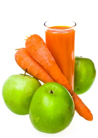 Apples, carrots and juice in a glassの写真素材