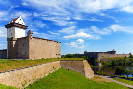Two ancient fortresses on the parties from the river which is border. Narva, Estonia and Ivangorod behind the river, Russia.の写真素材