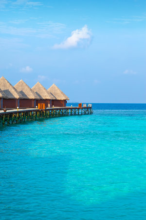 Island in ocean, overwater villas at the time sunset.のeditorial素材