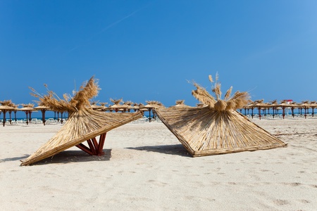Beach, beach umbrellas and two tops from beach umbrellasの写真素材