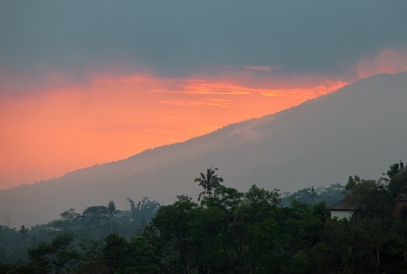 Indonesia. Bali. A sunset over mountainの写真素材