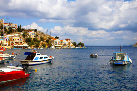 Small boats and houses on symi island, , Greece