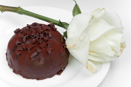 Chocolate cake and white roseの写真素材